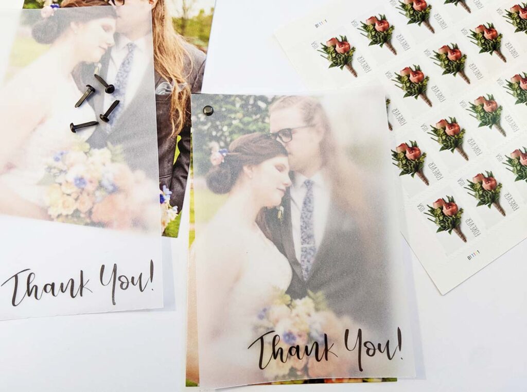Wedding thank you card with stamps next to it.